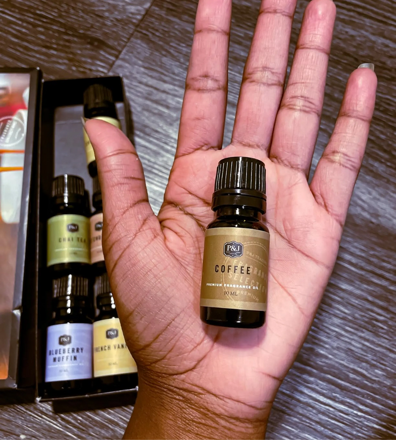 Camarra B. holding product